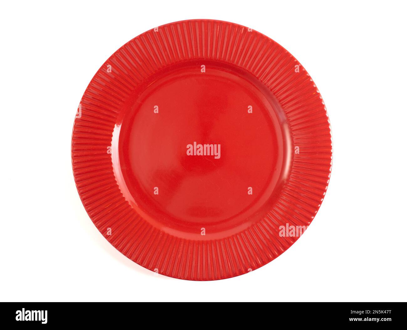 An Empty and Clean Red Plate Isolated on a White Background Stock Photo