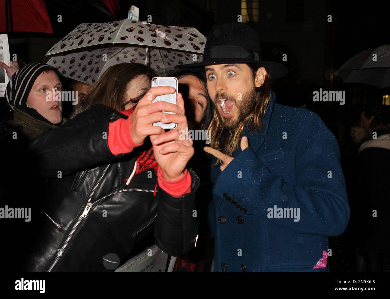 Actor Jared Leto poses for pictures with fans as he arrives on the red ...