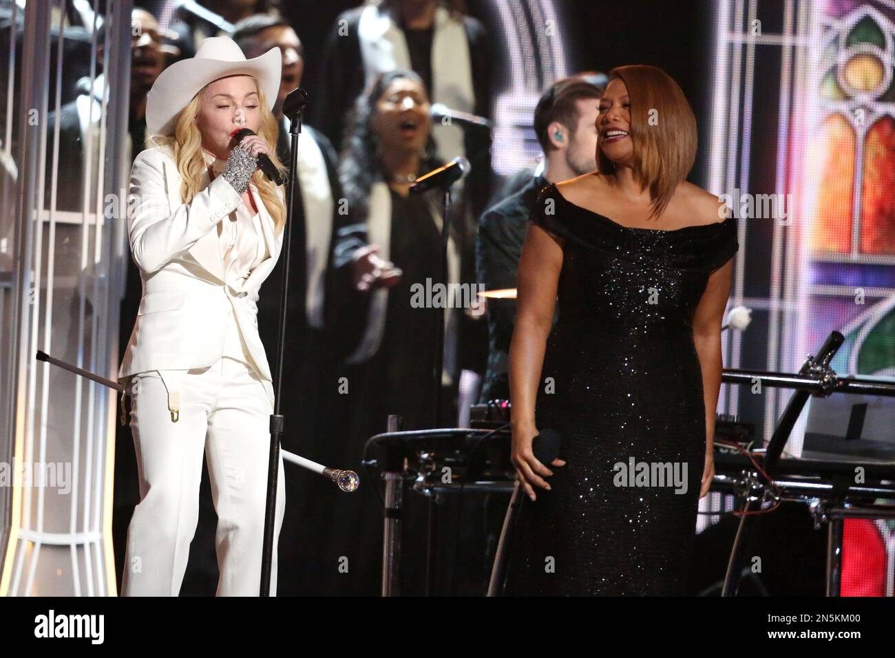 Madonna, left, and Queen Latifah perform on stage at the 56th annual