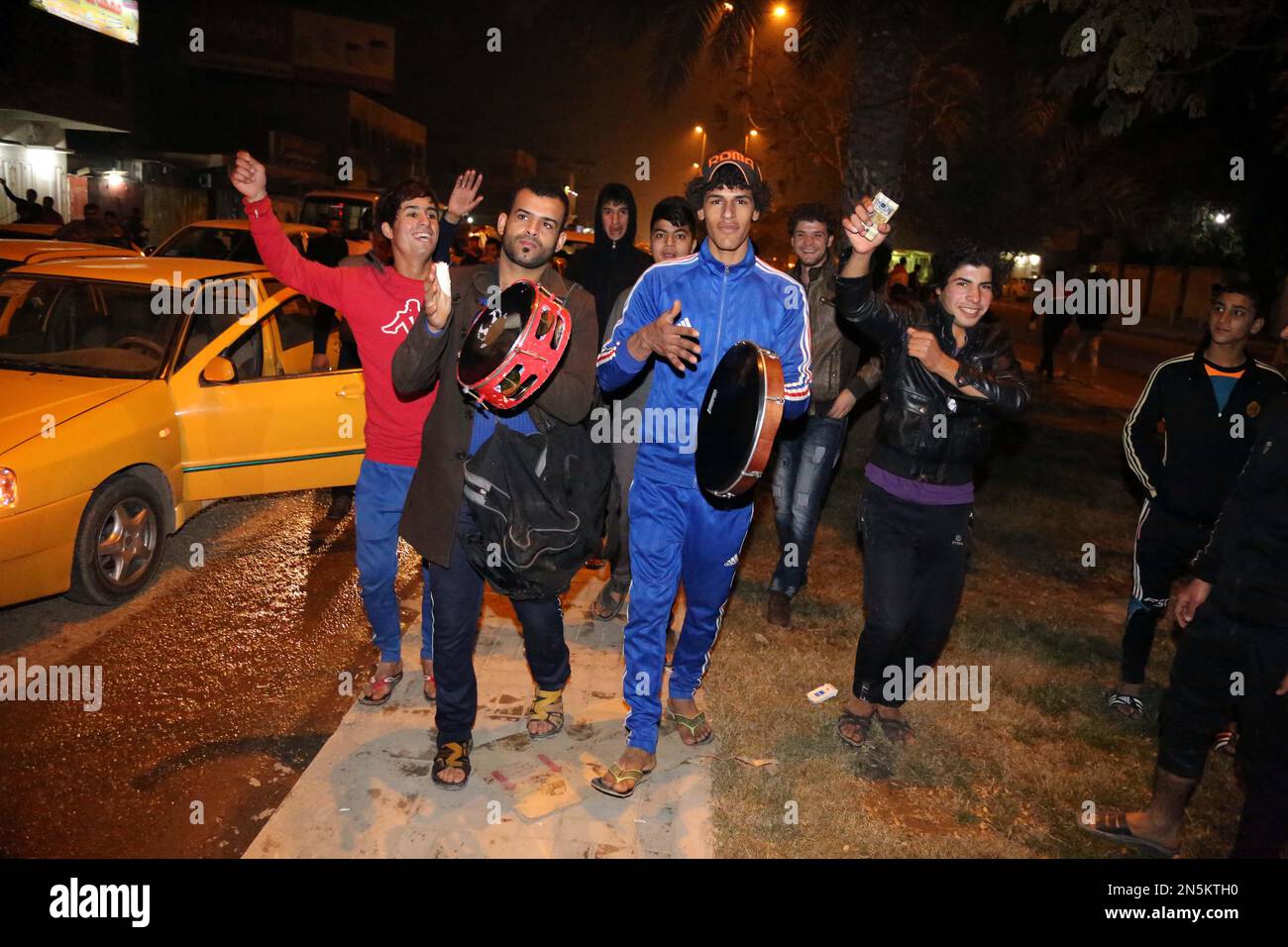 Iraqi soccer fans celebrate after their national team defeated Saudi ...