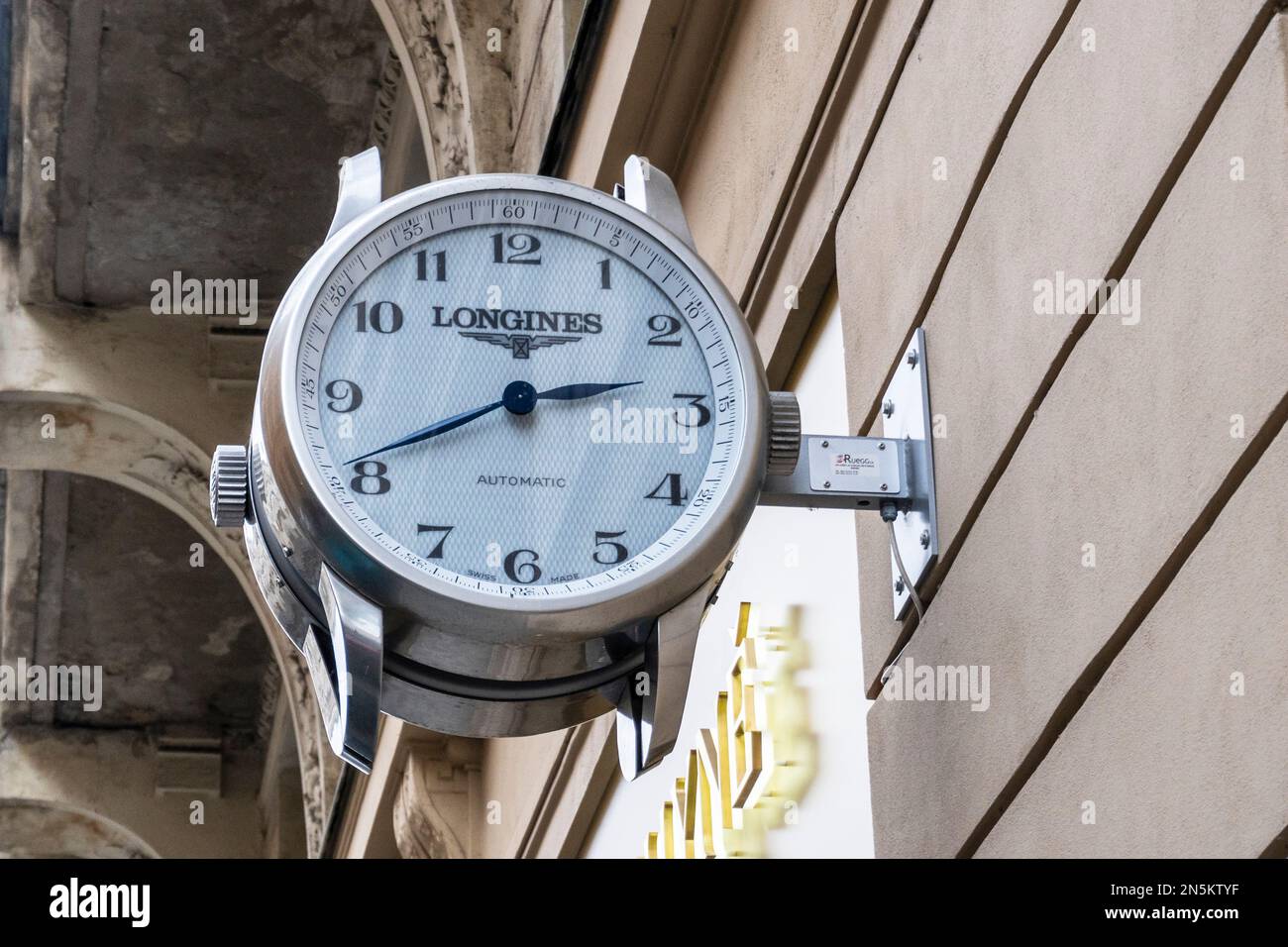 Wall mounted copy watch advertising Longines watches and time pieces, Prague Stock Photo