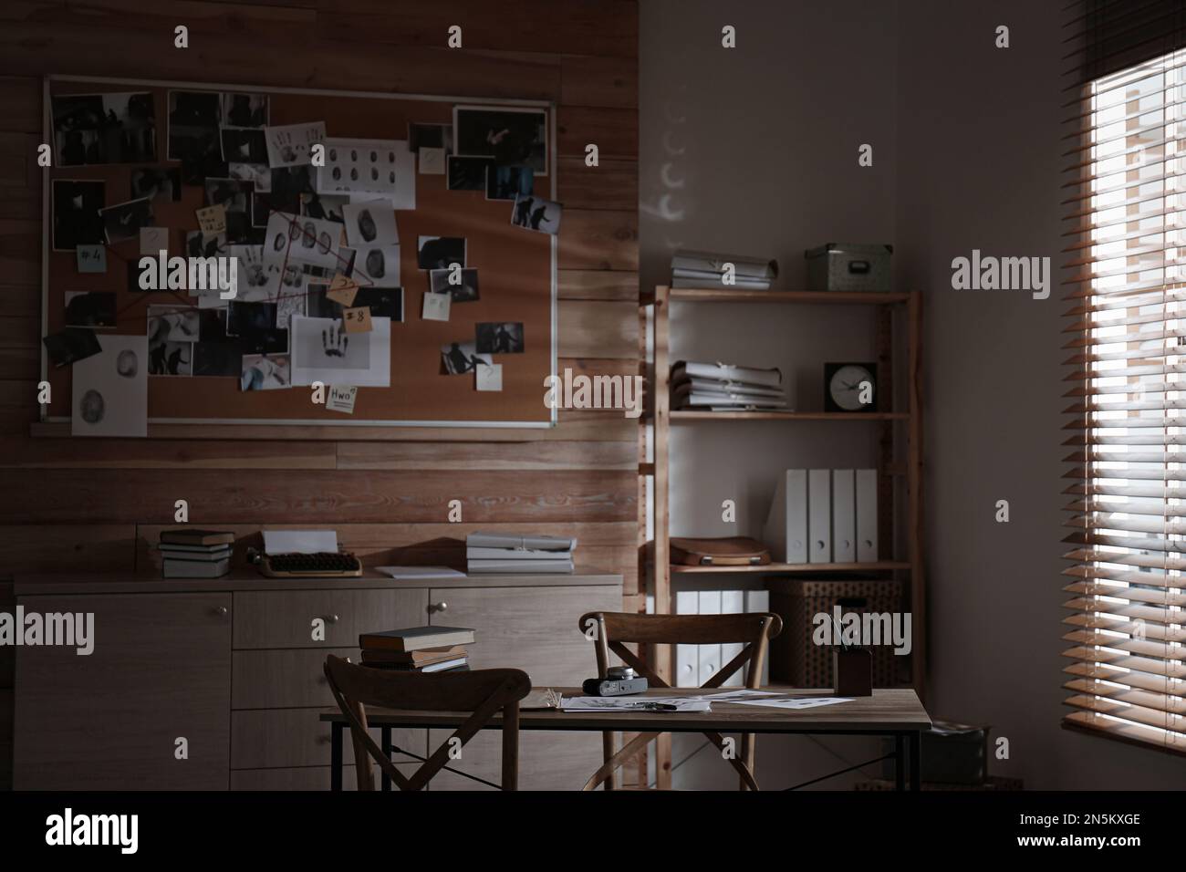 Detective office interior with evidence board on wall Stock Photo - Alamy