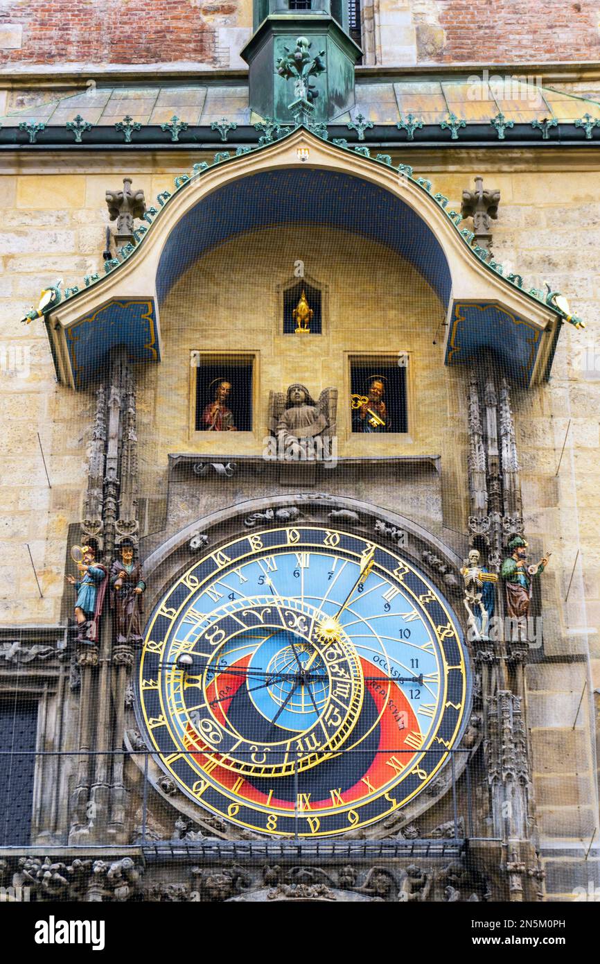 15th century (1410) tower of the Old Town Hall, Prague showing the 2 part astronomical clock with the gold cockerel, representing 'vigilance', Stock Photo
