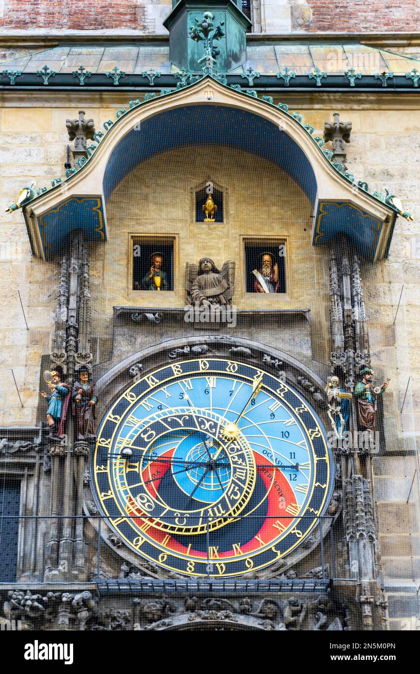 15th century (1410) tower of the Old Town Hall, Prague showing the 2 part astronomical clock with the gold cockerel, representing 'vigilance', Stock Photo