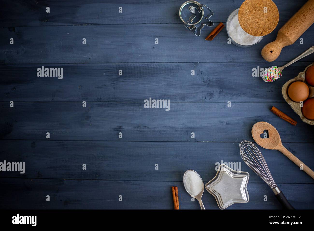 Cooking tools and ingredients concept flat lay with copy space. Baking  header with measuring spoons, wooden scoops, whisks, rolling pin, cookie  cutter Stock Photo - Alamy