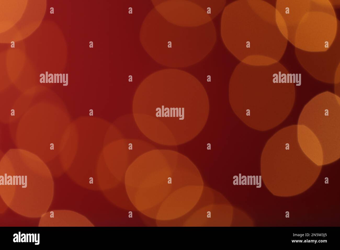 Blurred view of festive lights on red background. Bokeh effect Stock ...