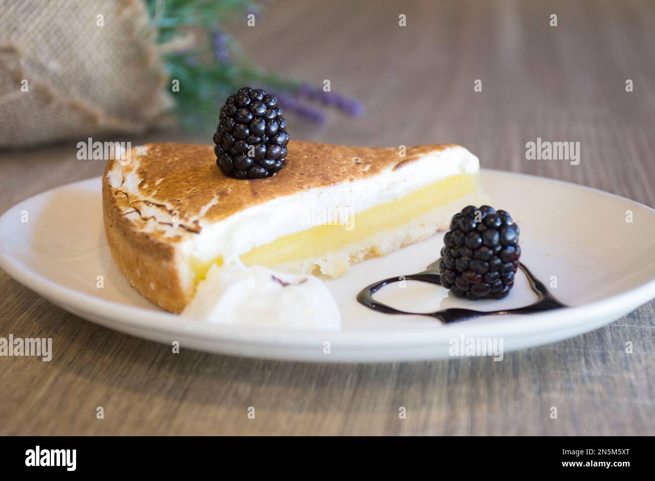 Lemon Pie or Lemon tart is a tart formed by a shortcrust pastry or puff pastry base that is filled with lemon cream. Stock Photo