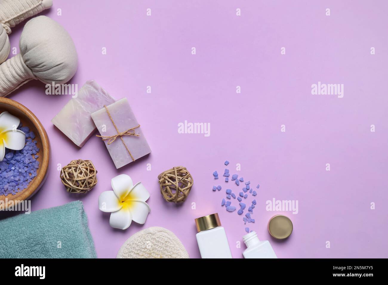 Flat lay composition with spa items on violet background. Space for text Stock Photo
