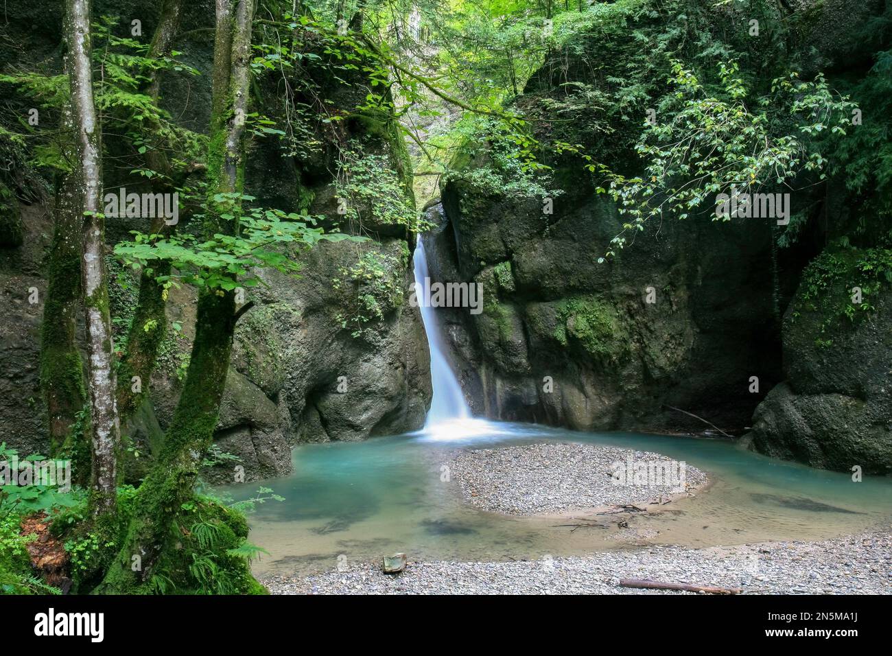 Beautiful waterfall with motion blur in a Central European forest horizontal orientation Stock Photo