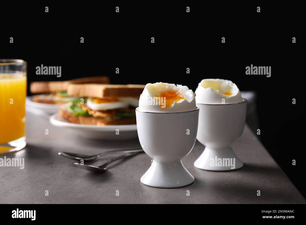https://c8.alamy.com/comp/2N5MANC/soft-boiled-eggs-served-on-grey-table-space-for-text-2N5MANC.jpg
