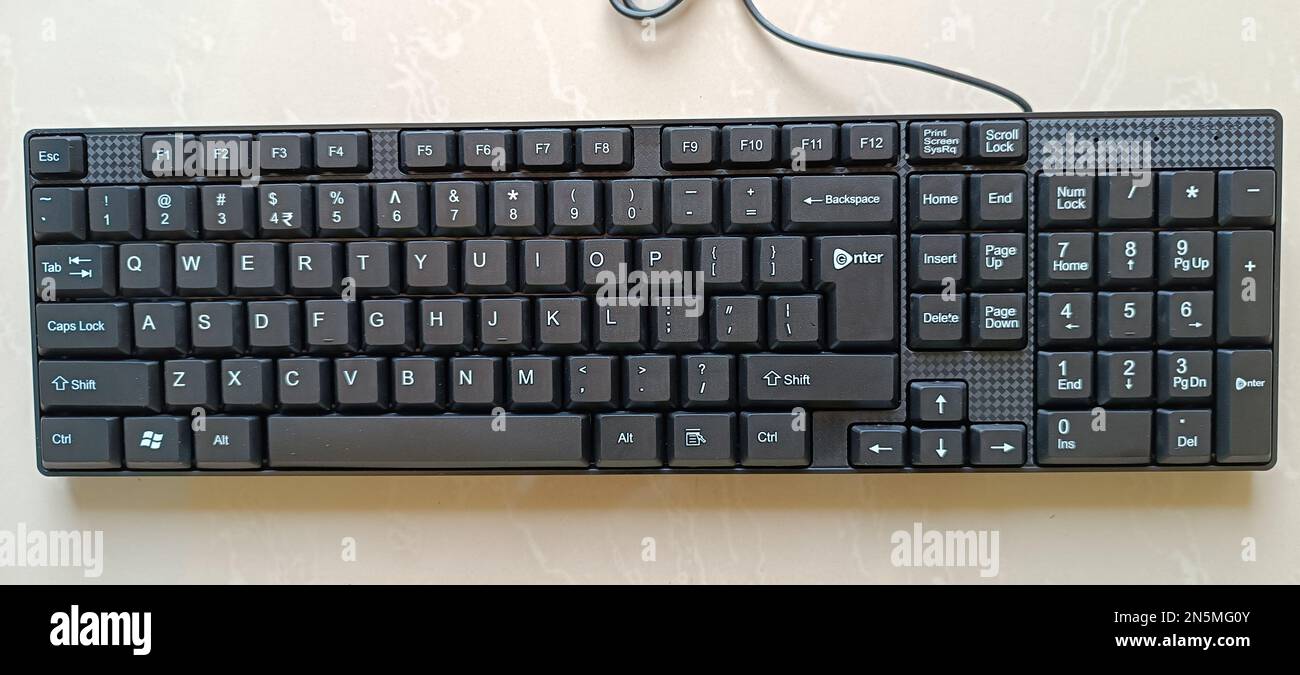 Black computer keyboard on the white background. Top view. Stock Photo