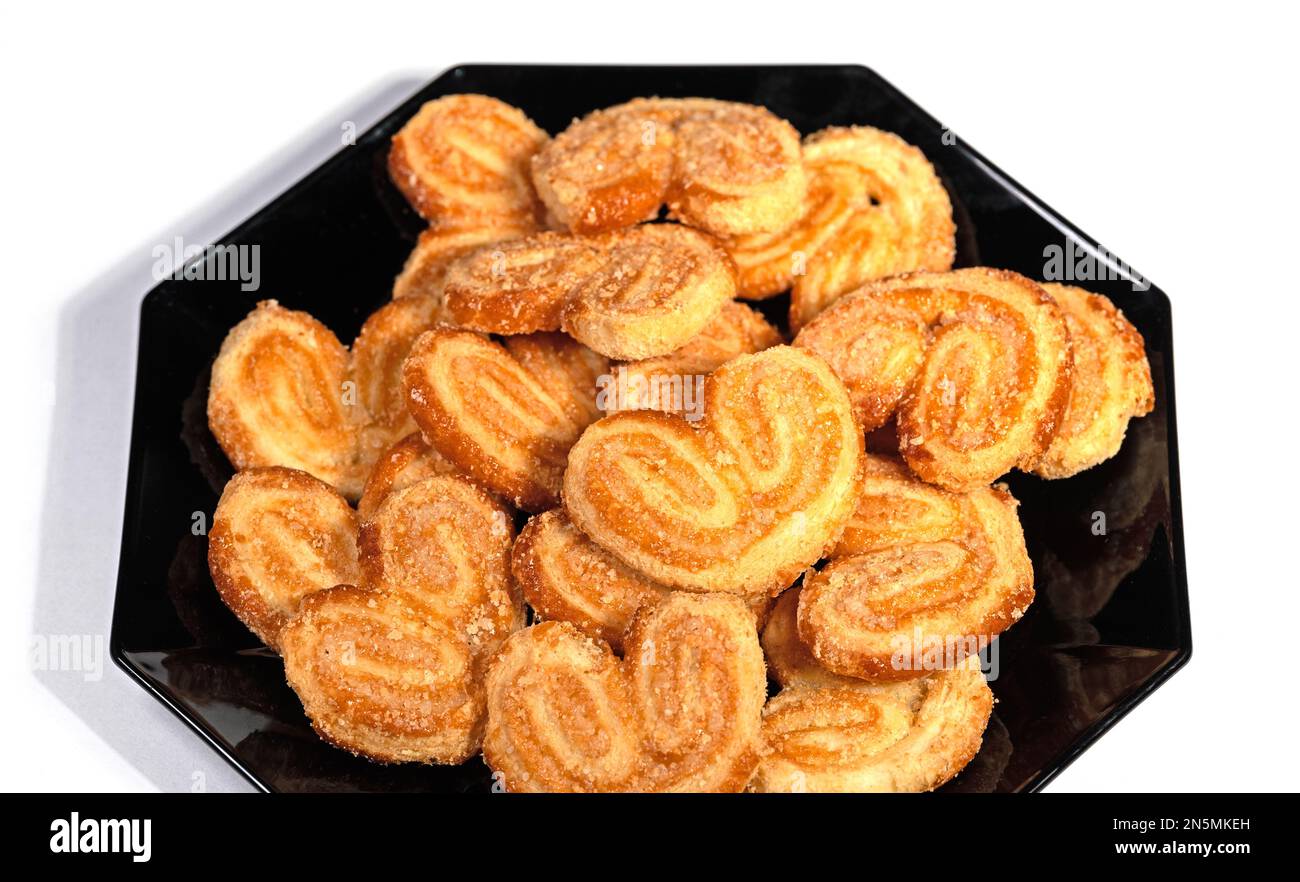 Pig ears on a black plate Stock Photo Alamy