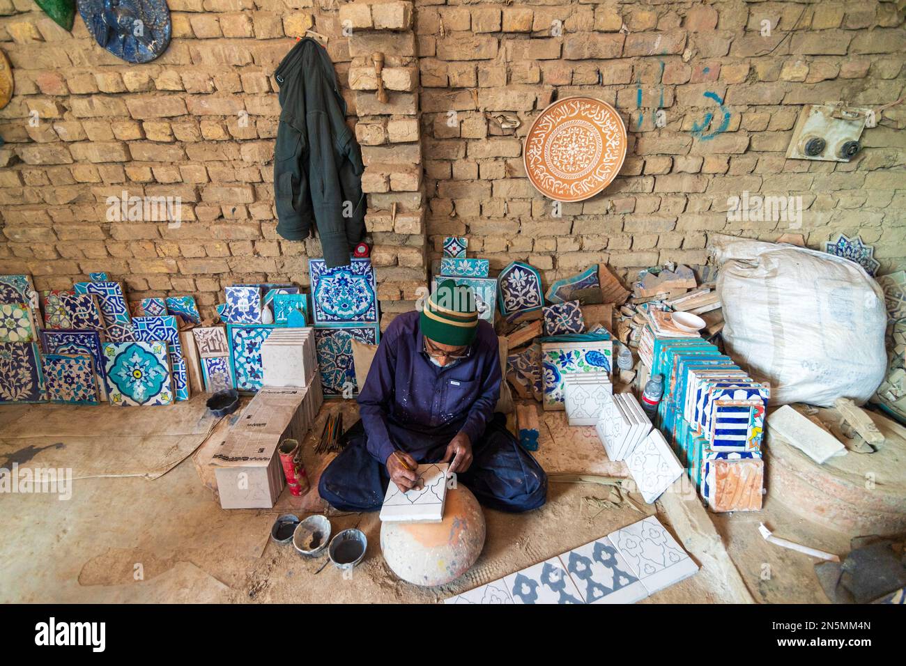 Hala Sindh 2022, an old Man is making Colorful blue clay tiles in Hala