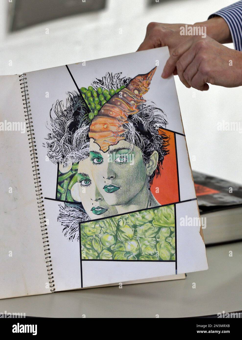 Mary Dowd Of Myers Fine Art Holds Up A Drawing Of Madonna Done By mary-dowd-of-myers-fine-art-holds-up-a-drawing-of-madonna-done-by