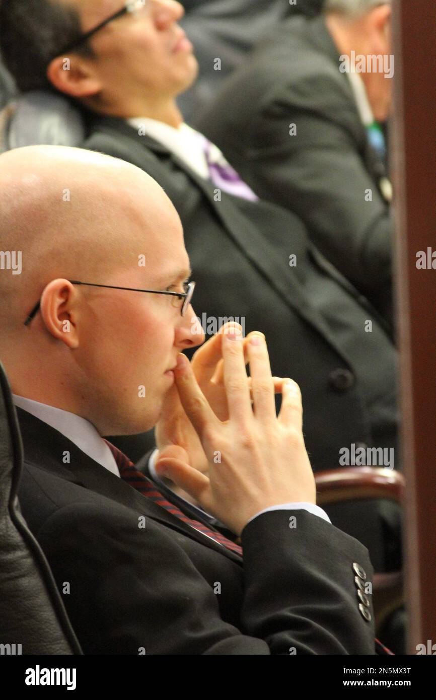 State Rep. Jonathan KreissTomkins, DSitka, listens as bills are