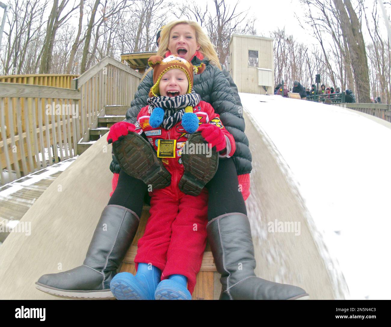 Jake Chalmers, front, and his mother, Wendi, from Aurora, Ohio ride