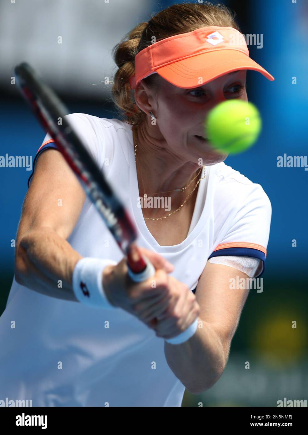 Ekaterina Makarova of Russia hits a backhand return to Li Na of China