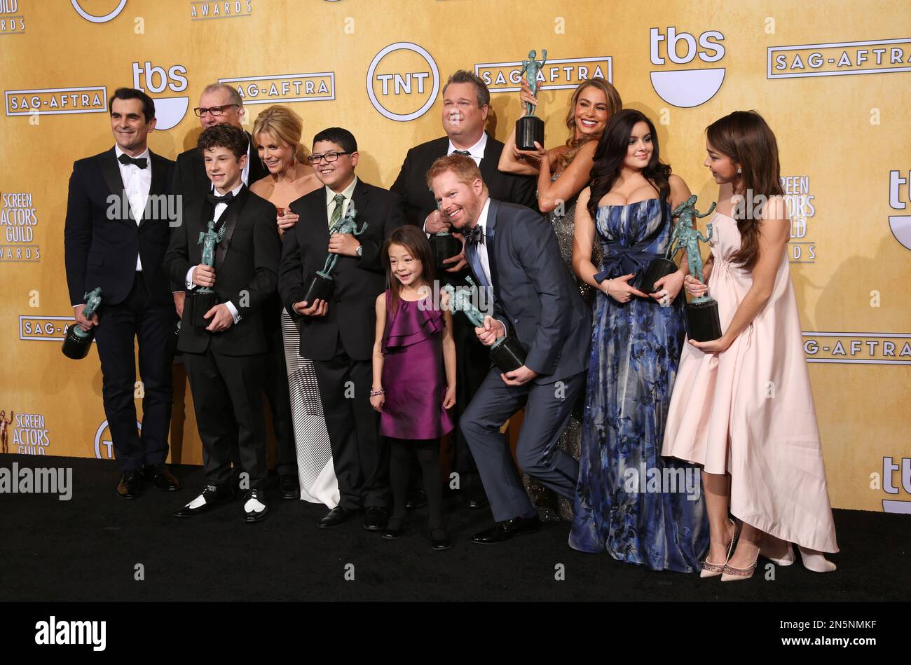 The cast of, Modern Family", pose with their awards for outstanding performance by an ensemble ...