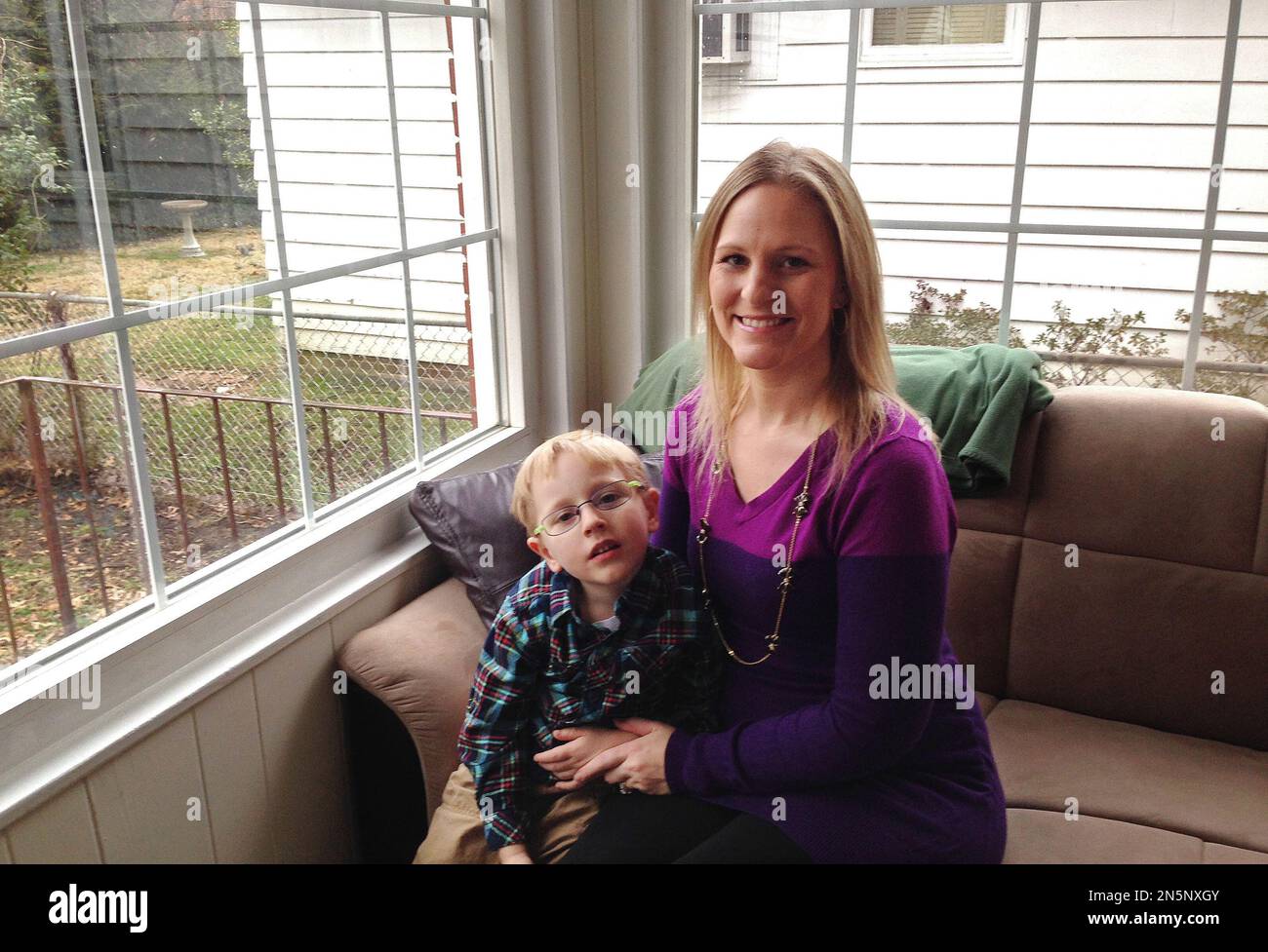 Sarah Bergstrom poses for a photo with her son Blake, 4, Friday, Jan. 17,  2014, in her home in Charleston, W.Va. The 29-year-old nurse who is 4  months pregnant with her second, image size:1300x977