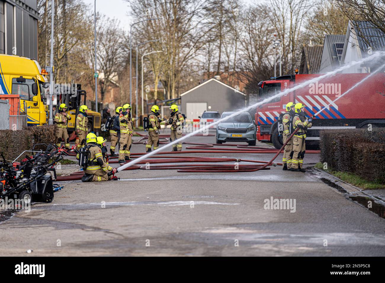 HETEREN, NETHERLANDS - FEBRUARY 9: Large structure fire in Poort van Midden  Gelderland Oranje at the Poort van Midden Gelderland Oranje. The fire broke  out in a company for garden- and parkmachines (