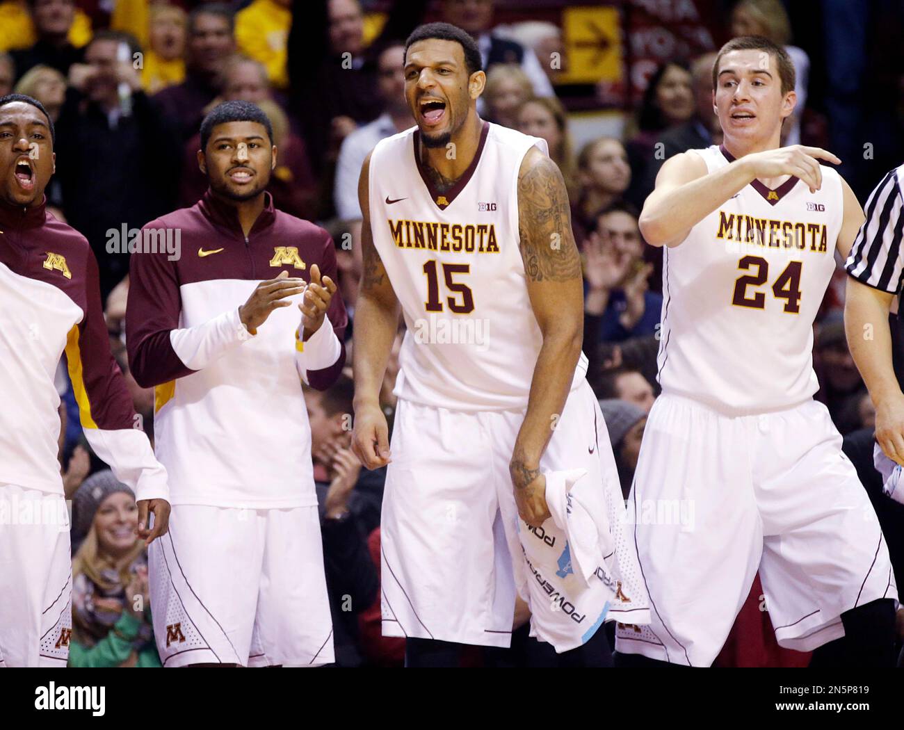 Minnesota's Maurice Walker (15), Joey King (24) and others celebrate a