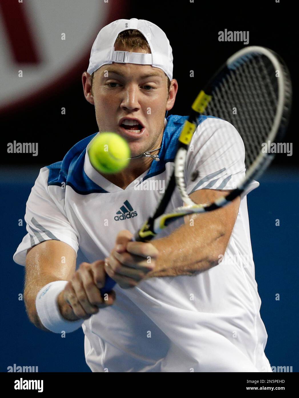 Jack Sock of the U.S. hits a backhand return to Gael Monfils of France