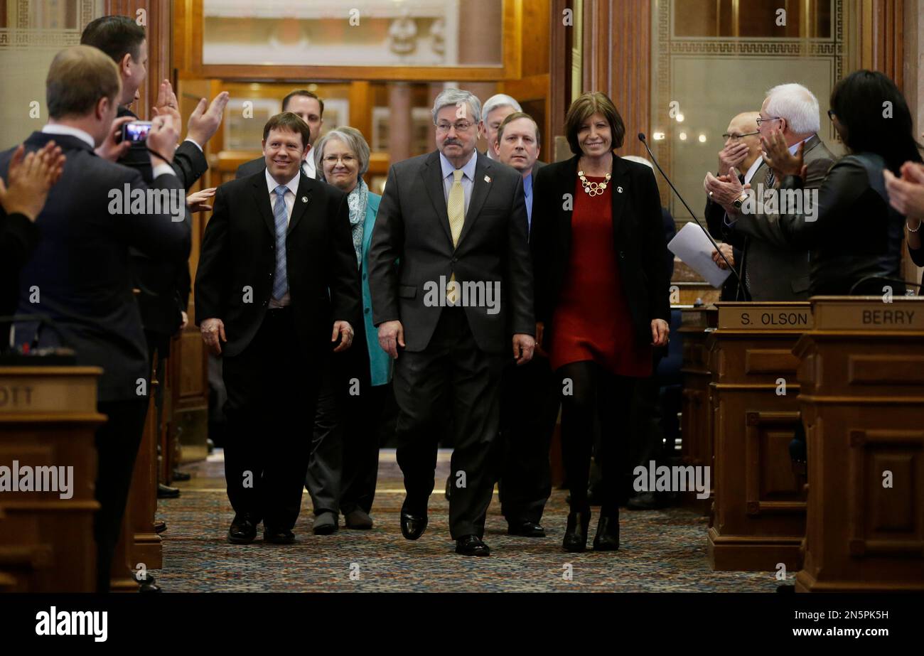 Iowa Gov. Terry Branstad, center, enters the Iowa House chambers to
