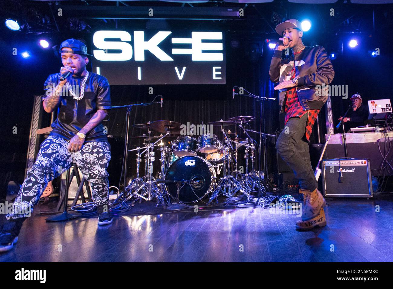 Rapper Kid Ink (L) and Tyga perform on stage during filming of SKEE ...