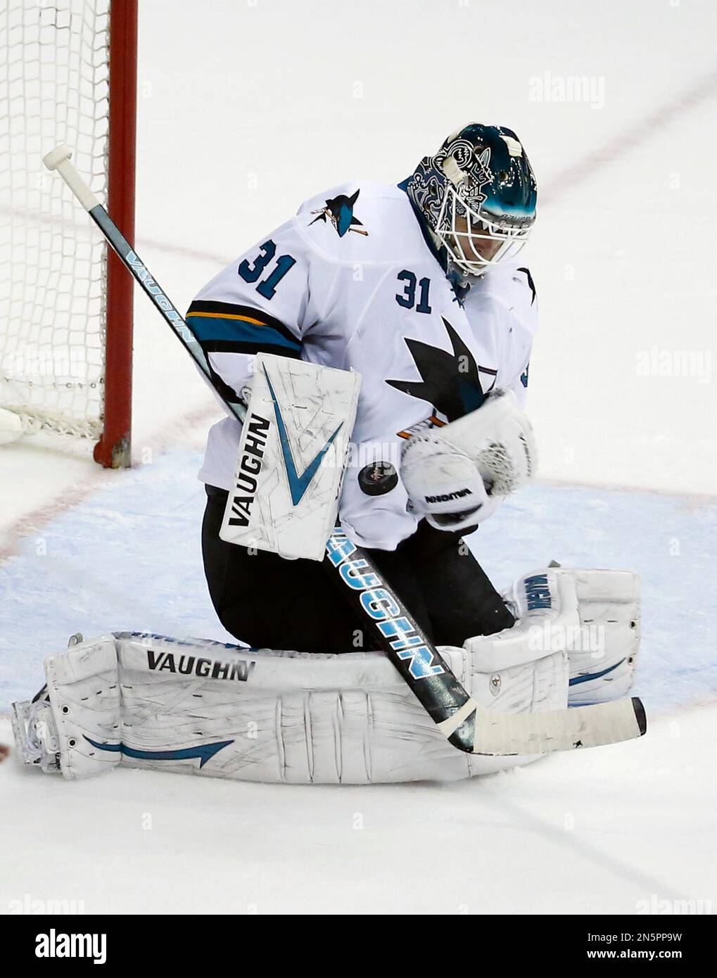 San Jose Sharks goalie Antti Niemi (31), from Finland, stops the puck in  the third period of an NHL hockey game against the Washington Capitals,  Tuesday, Jan. 14, 2014, in Washington. The