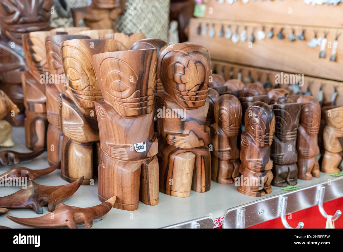 Handmade wooden tiki sculptures sold at the Papeete local market, Tahiti, French Polynesia Stock Photo