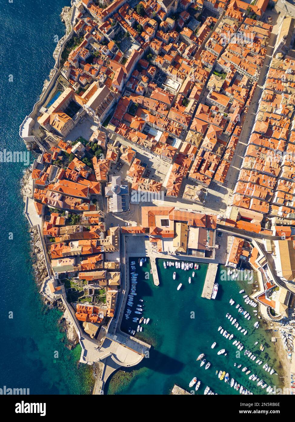 Aerial drone view of the Old historic city of Dubrovnik in Croatia, UNESCO World Heritage site. Famous tourist attraction in the Adriatic Sea. Stock Photo