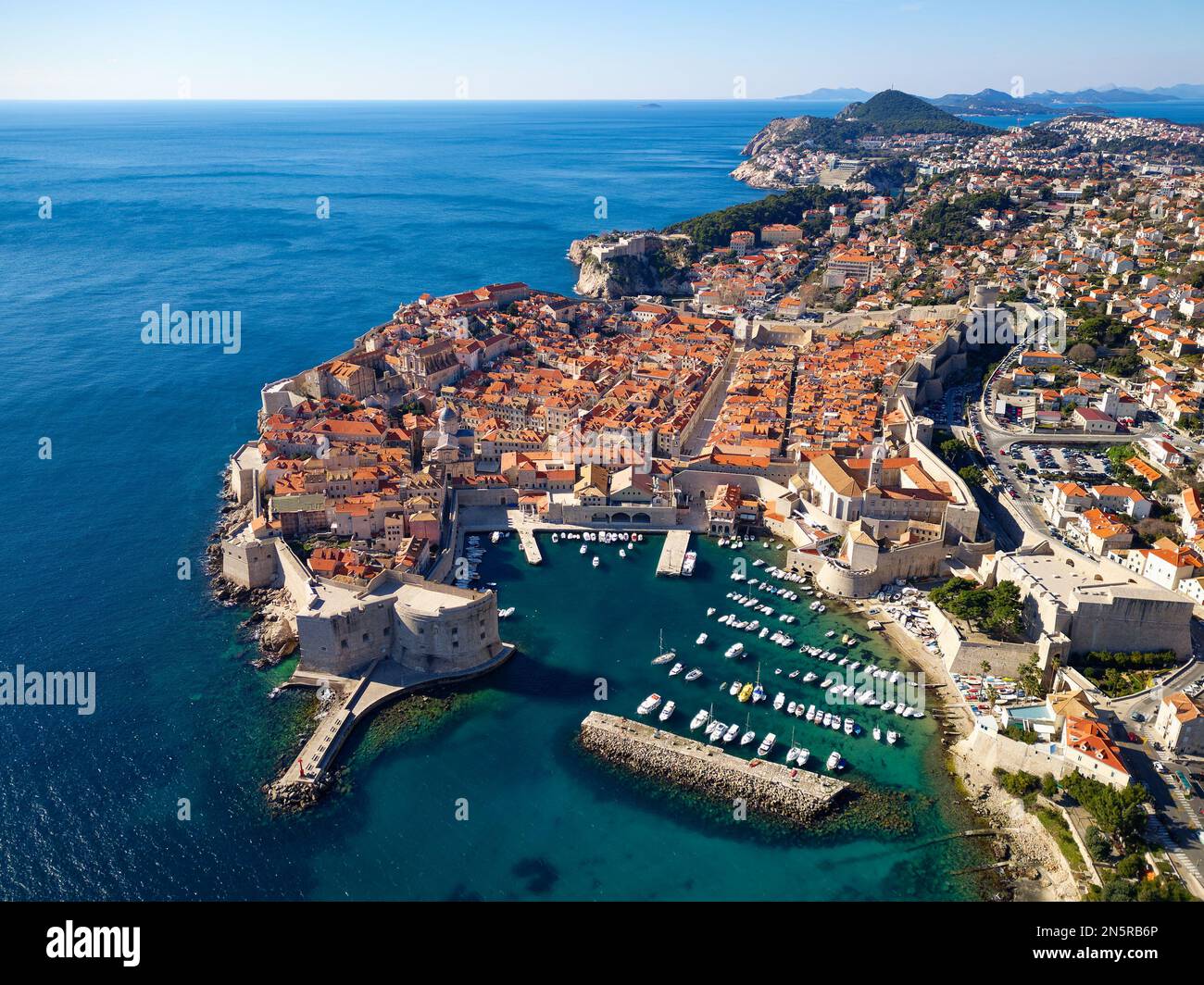 Aerial drone view of the Old historic city of Dubrovnik in Croatia, UNESCO World Heritage site. Famous tourist attraction in the Adriatic Sea. Stock Photo