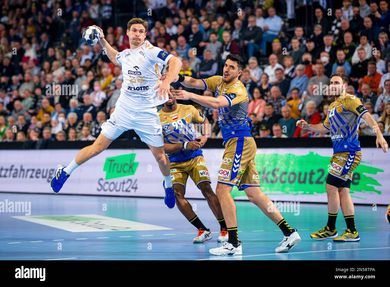 Kiel's Rune Dahmke, left, scores during the Champions League handball ...
