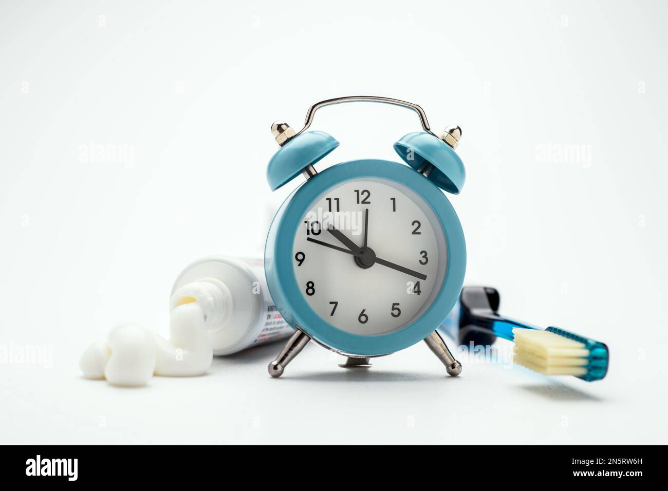 Toothpaste and toothbrush over a white background Stock Photo - Alamy