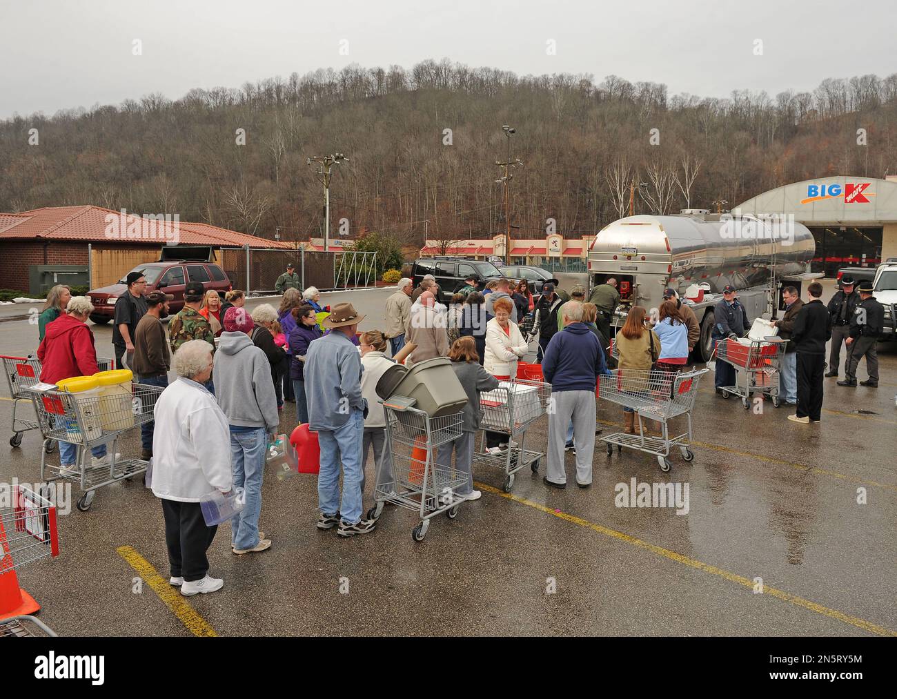 West Virginia State Troopers fill water jugs at the Kmart in Elkview, W