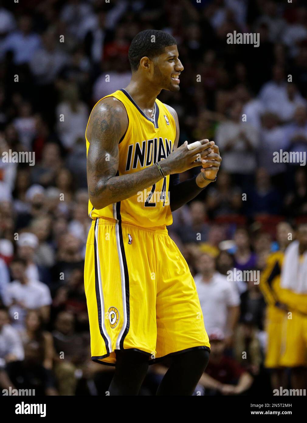Indiana Pacers' Paul George (24) reacts after fouling in the second half of  an NBA basketball game against the Miami Heat, Wednesday, Dec. 18, 2013, in  Miami. The Heat defeated the Pacers