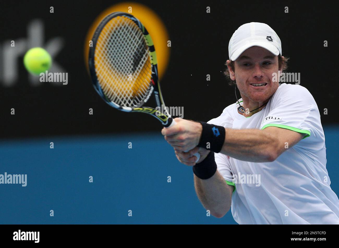 Blaz Kavcic of Slovakia plays a backhand shot in his match against Bernard  Tomic of Australia during the Sydney International Tennis Tournament in  Sydney, Australia, Wednesday, Jan. 8, 2014. (AP Photo/Rob Griffith