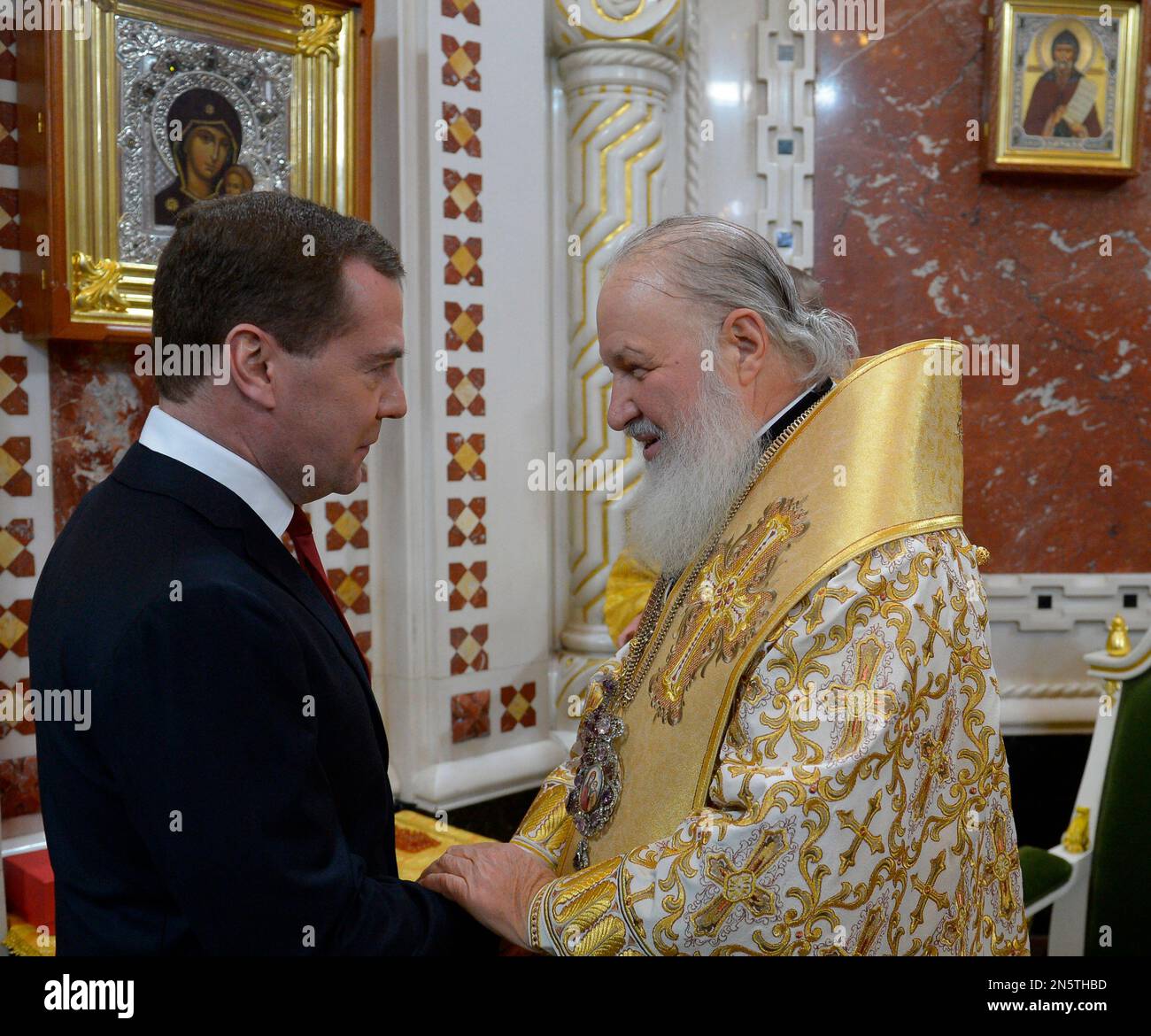 Russian Orthodox Patriarch Kirill, right, speaks to Russian Prime