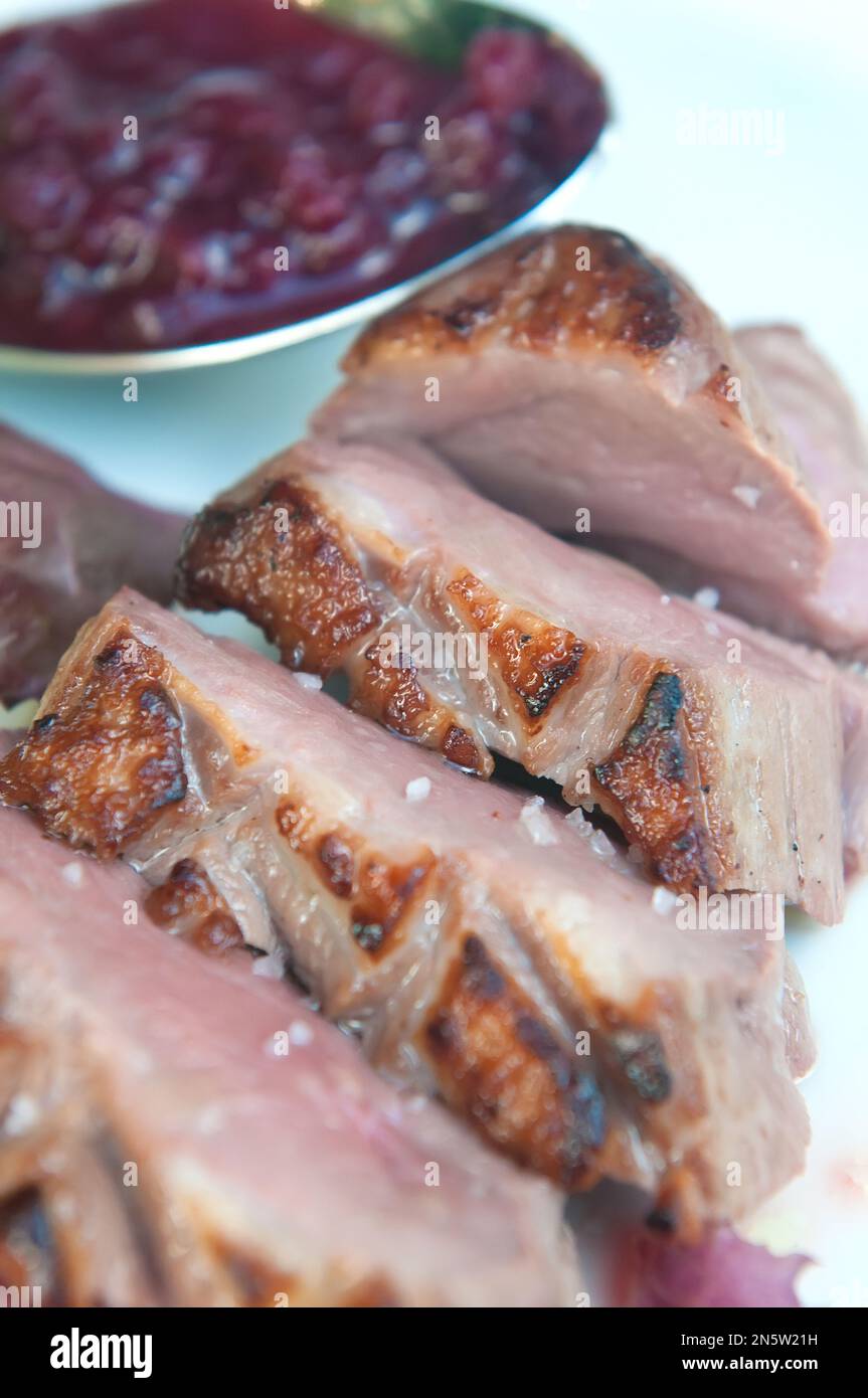 Delicious grilled duck fillets with its garnish Stock Photo