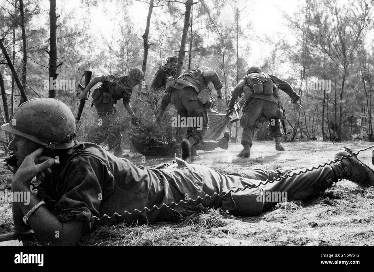 First Lieut. Al LaVezzi of Itasca, Ill., phones for an artillery strike ...