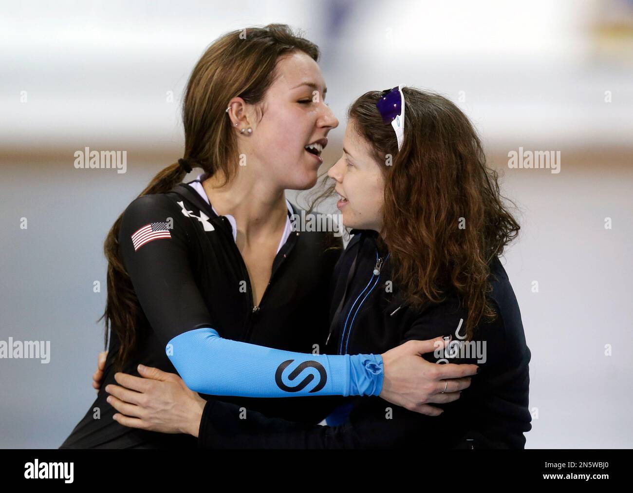 First place finisher Maria Lamb, right, receives a hug from Petra Acker