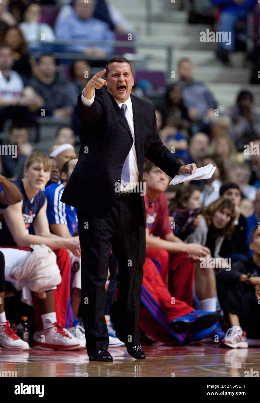 Detroit Pistons assistant coach John Loyer shouts directions from the