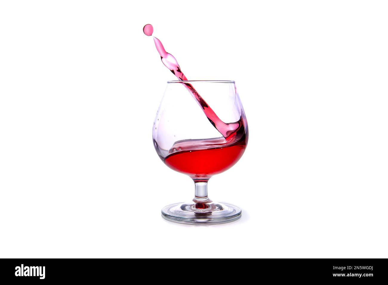 moving a glass of red wine on a white background Stock Photo - Alamy