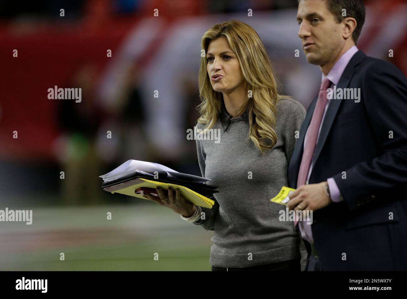 Sportscaster Erin Andrews walks on the field before the first half