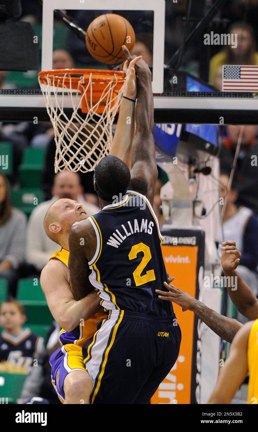 Los Angeles Lakers' Chris Kaman, left, blocks a shot by Utah Jazz's Marvin Williams (2) during the first half of an NBA basketball game Friday, Dec. 27, 2013, in Salt Lake City. (AP Photo/Gene Sweeney Jr.) Stock Photo