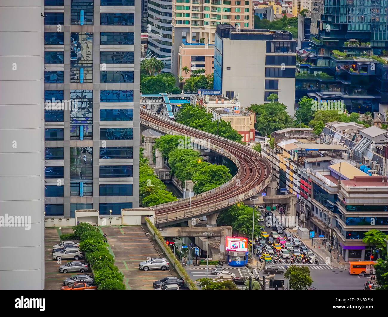 Aerial view of Bangkok BTS skytrain system rails turning among many ...