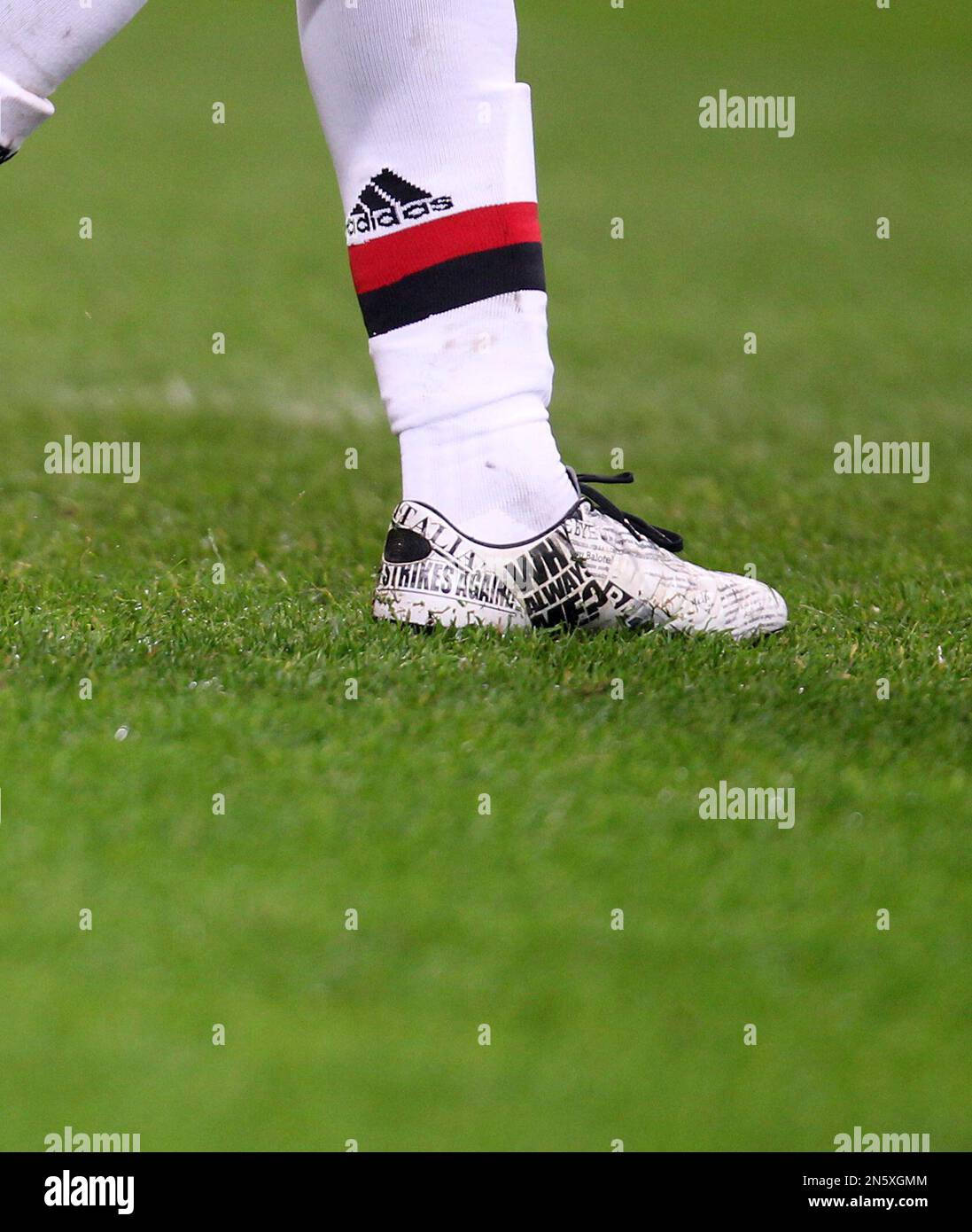 AC Milan forward Mario Balotelli sports a pair of new shoes during the  Serie A soccer match between Inter Milan and AC Milan at the San Siro  stadium in Milan, Italy, Sunday,