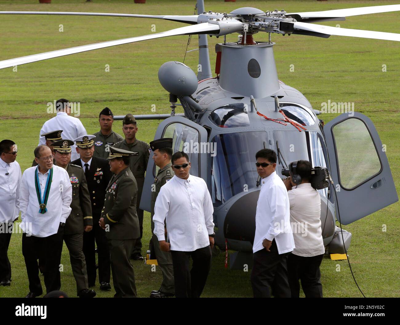 Philippine President Benigno Aquino III, left, inspects the newly