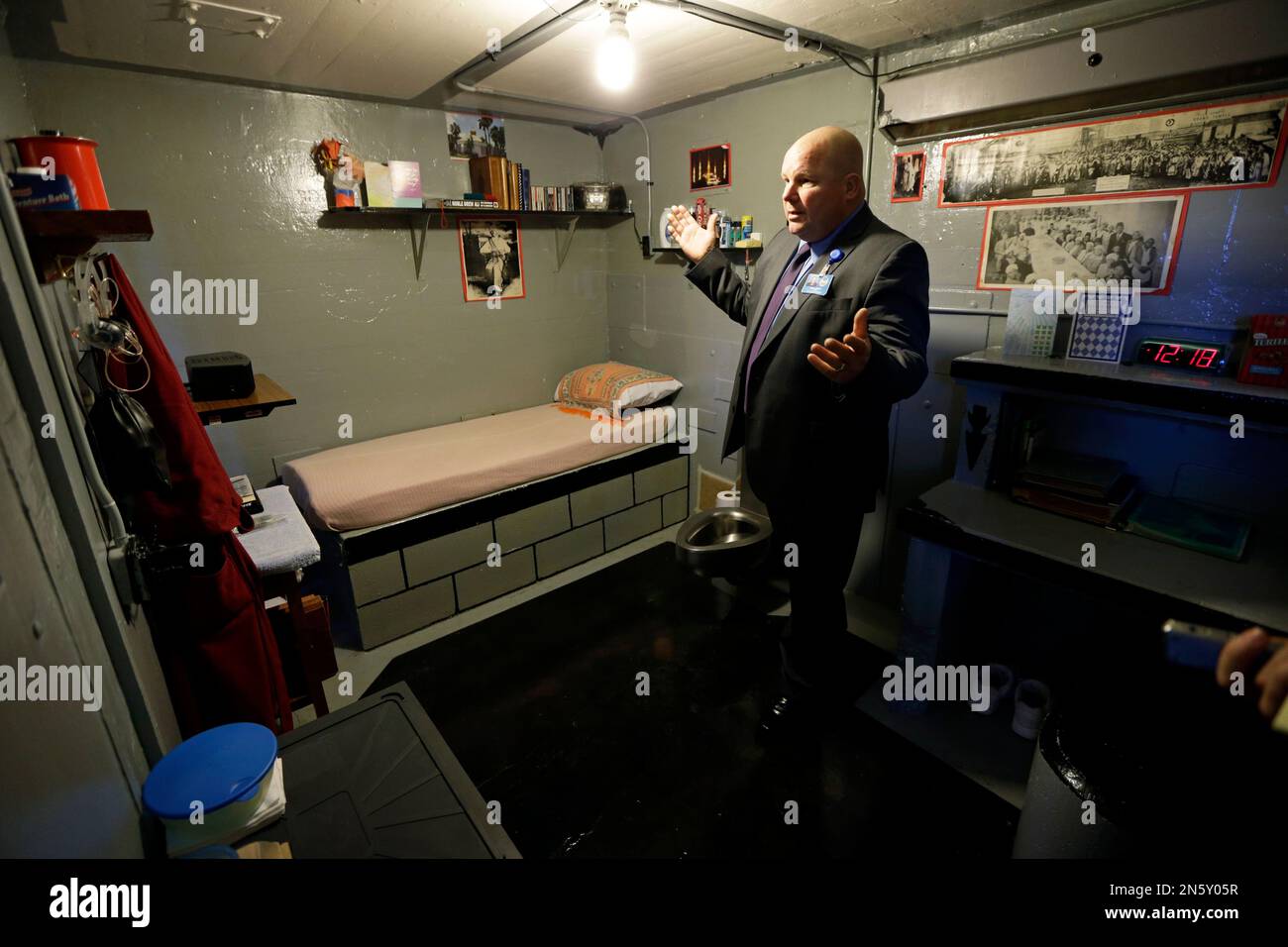 In this Monday, Nov. 18, 2013 photo, Warden Nick Ludwick stands in an inmate's cell at the Iowa