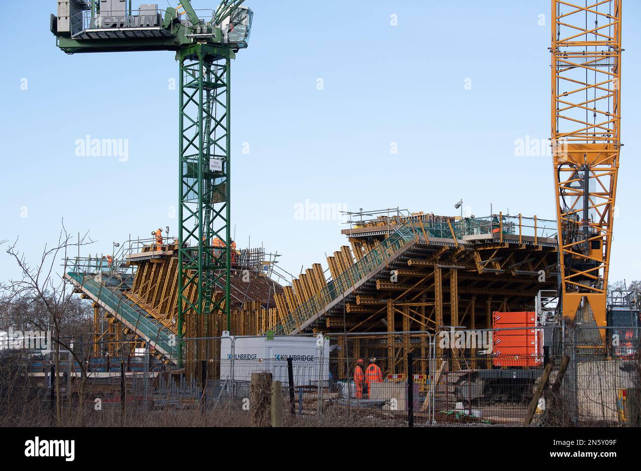 Harefield, UK. 9th February 2023. HS2 High Speed Rail 2 construction for the piers of the Colne Valley Viaduct across Broadwater Lake in the London Borough of Hillingdon. The lake is a Wildlife Trusts Site of Special Scientfic of Interest where hundreds of trees have been felled by HS2. The Wildlife Trusts have reported that the metric HS2 use for their construction having no net loss to nature is “fundamentally flawed” and that HS2 have missed off ponds, hedgerows and trees from their maps. The Wildlife Trusts have called for all HS2 works to stop and that HS2 'must repair nature in a way tha Stock Photo